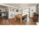 Bright dining room that opens to the kitchen and backyard at 7915 Allisonville Rd, Indianapolis, IN 46250