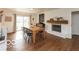 Bright dining room with a fireplace and hardwood flooring at 7915 Allisonville Rd, Indianapolis, IN 46250