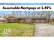Charming single-story brick home featuring an attached two-car garage and a well-maintained front yard at 7915 Allisonville Rd, Indianapolis, IN 46250