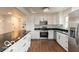 Bright kitchen featuring stainless steel appliances, granite countertops, and hardwood flooring at 7915 Allisonville Rd, Indianapolis, IN 46250