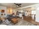 Open living room with modern ceiling fan, and opens to the kitchen and dining areas at 7915 Allisonville Rd, Indianapolis, IN 46250