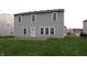 Expansive backyard featuring a well-maintained lawn and classic neutral siding at 796 Hickory Pine Dr, Whiteland, IN 46184