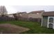 Large fenced-in backyard with green grass and a brick patio is perfect for outdoor fun at 796 Hickory Pine Dr, Whiteland, IN 46184
