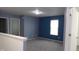 Bedroom with blue accent wall and neutral carpeting for a comfortable living space at 796 Hickory Pine Dr, Whiteland, IN 46184