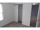 Bright bedroom with neutral carpet, closet, and natural light to create a cozy atmosphere at 796 Hickory Pine Dr, Whiteland, IN 46184