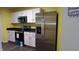 Kitchen features modern stainless steel appliances, white cabinets and dark countertops at 796 Hickory Pine Dr, Whiteland, IN 46184