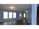 Bright living room boasts fresh paint, new floors and plenty of natural light from windows at 796 Hickory Pine Dr, Whiteland, IN 46184