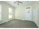 Comfortable bedroom featuring carpet, natural light, and ceiling fan at 804 N California St, Indianapolis, IN 46202
