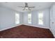 A bright bedroom with a ceiling fan, and three windows that provide ample natural light at 804 N California St, Indianapolis, IN 46202