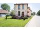 Charming two-story home with a front porch and beautiful, mature landscaping at 804 N California St, Indianapolis, IN 46202