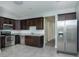 Modern kitchen with stainless steel appliances, granite countertops, and dark cabinetry at 804 N California St, Indianapolis, IN 46202
