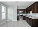 Bright and airy kitchen featuring stainless steel appliances, granite countertops, and tile flooring at 804 N California St, Indianapolis, IN 46202