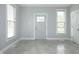 Bright room with new gray paint, white trim, tile flooring, and two windows offering lots of natural light at 804 N California St, Indianapolis, IN 46202