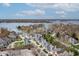 Stunning aerial view of homes, lake, and surrounding landscape at 9769 Marina Village Dr, Indianapolis, IN 46256