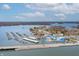 Overhead view showcasing the marina with boat slips, surrounding neighborhood, and lake at 9769 Marina Village Dr, Indianapolis, IN 46256