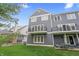 Townhouse backyard featuring a spacious lawn, private balcony, and outdoor seating area at 9769 Marina Village Dr, Indianapolis, IN 46256