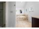 Bathroom features a soaking tub, white walls, tiled floor, and view into the shower at 9769 Marina Village Dr, Indianapolis, IN 46256