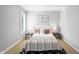 Cozy bedroom with modern decor, plush bedding, and ample natural light from the window at 9769 Marina Village Dr, Indianapolis, IN 46256