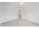 Neutral carpet in this bedroom with a double door closet and view to stairway at 9769 Marina Village Dr, Indianapolis, IN 46256