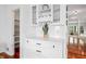 Dining room features modern lighting, white cabinetry, and easy access to the pantry at 9769 Marina Village Dr, Indianapolis, IN 46256