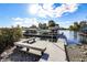 Picturesque dock with boat lifts on a clear lake, surrounded by trees and scenic views under a sunny sky at 9769 Marina Village Dr, Indianapolis, IN 46256