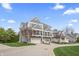 Well-maintained townhouse with a two-car garage, a private balcony, and attractive landscaping at 9769 Marina Village Dr, Indianapolis, IN 46256
