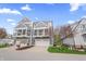 Townhouse with a two-car garage, private balcony, and well-kept front lawn at 9769 Marina Village Dr, Indianapolis, IN 46256