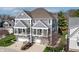 A view of the three-story home's stylish facade and attached garages and balconies at 9769 Marina Village Dr, Indianapolis, IN 46256