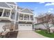 Charming townhouse with balcony, two-car garage, and landscaped front yard at 9769 Marina Village Dr, Indianapolis, IN 46256