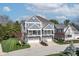 Beautiful townhouse featuring a two-car garage, balcony, and charming architectural details at 9769 Marina Village Dr, Indianapolis, IN 46256
