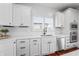 Bright kitchen features stainless steel appliances, white cabinets, and stylish fixtures at 9769 Marina Village Dr, Indianapolis, IN 46256