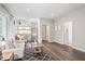 Open concept living room with hardwood floors, neutral paint, kitchenette and neutral colored furniture at 9769 Marina Village Dr, Indianapolis, IN 46256