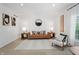 Cozy living room featuring a comfortable sofa, stylish decor, and plenty of natural light at 9769 Marina Village Dr, Indianapolis, IN 46256