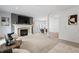Spacious open-concept living area with a fireplace, dining area, and abundant natural light at 9769 Marina Village Dr, Indianapolis, IN 46256