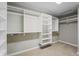 Walk-in closet with built in shelving and white walls at 9769 Marina Village Dr, Indianapolis, IN 46256