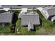Overhead view highlights the sunroom addition and raised garden beds, all enclosed by a black metal fence at 9831 N Port Dr, McCordsville, IN 46055