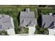 High-angle aerial view showing the roofline, manicured yard, and ample driveway space at 9831 N Port Dr, McCordsville, IN 46055