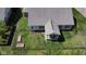 Aerial of the home featuring the sunroom and two raised garden beds inside the fenced in backyard at 9831 N Port Dr, McCordsville, IN 46055