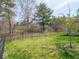 Large, grassy backyard enclosed by a fence, offering privacy and ample space for recreation and gardening at 9831 N Port Dr, McCordsville, IN 46055