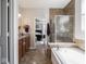 A view from the vanity to the walk-in shower and jacuzzi tub at 9831 N Port Dr, McCordsville, IN 46055
