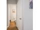 A hallway view of a bathroom; the neutral tones enhance the room's warm and inviting atmosphere at 9831 N Port Dr, McCordsville, IN 46055