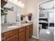This bathroom vanity features double sinks, wood cabinets, and granite counters at 9831 N Port Dr, McCordsville, IN 46055