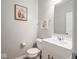 This bathroom features a stylish vanity with a modern sink and a decorative wall art at 9831 N Port Dr, McCordsville, IN 46055