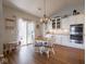 Cozy dining area with a chandelier and access to a screened in porch through sliding glass doors at 9831 N Port Dr, McCordsville, IN 46055