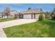 Well-maintained home with a spacious driveway and a beautifully landscaped front yard at 9831 N Port Dr, McCordsville, IN 46055