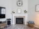 Close-up of a modern fireplace with a decorative mantel and hearth at 9831 N Port Dr, McCordsville, IN 46055