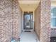 Elegant entryway showcasing a decorative glass door and brick surround at 9831 N Port Dr, McCordsville, IN 46055