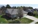 View of the home's front exterior with manicured lawn at 9831 N Port Dr, McCordsville, IN 46055