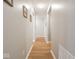 Hallway with wood-look floors, neutral paint, and recessed lighting at 9831 N Port Dr, McCordsville, IN 46055