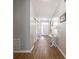 Inviting hallway with wood flooring, leading to the front door and other living areas at 9831 N Port Dr, McCordsville, IN 46055